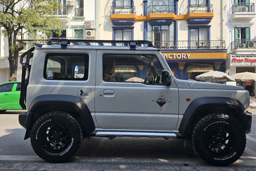 white Suzuki Jimny (2018+) fitted with Satin Black Magpie M-01 Wheels